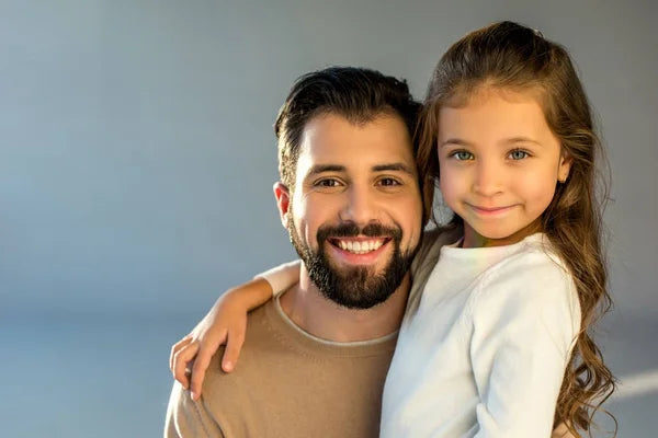 files/depositphotos_175220462-stock-photo-portrait-happy-father-daughter-looking.webp